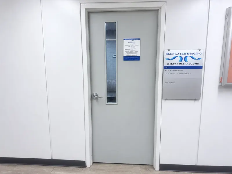 The entrance to Bluewater Imaging at 960 Lawrence Avenue West, Suite 203: the clinic door and its X-Ray and Ultrasound sign